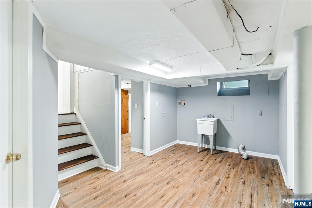 42 Meadow Lane Bloomfield, NJ 07003 - Photo 26 of 37 a view of a livingroom with wooden floor and staircase