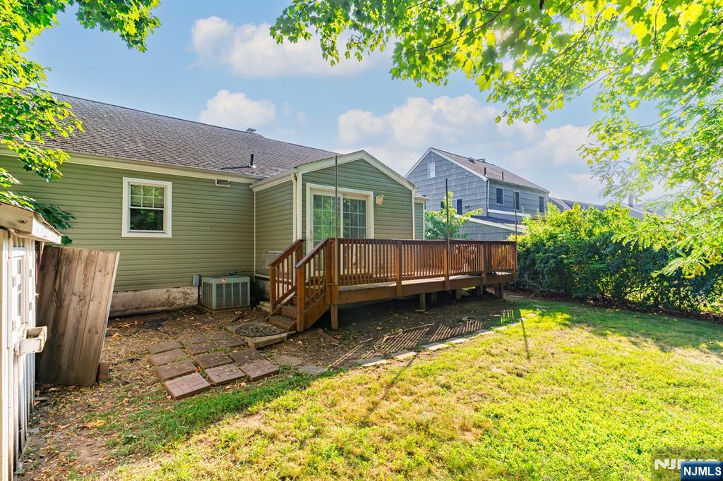 42 Meadow Lane Bloomfield, NJ 07003 - Photo 33 of 37 a backyard of a house with yard and outdoor seating