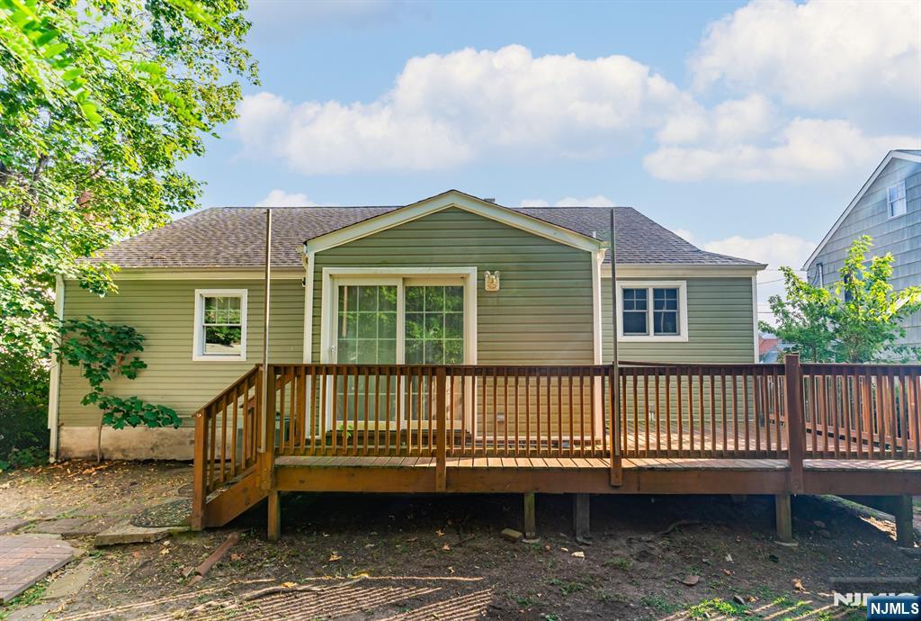 42 Meadow Lane Bloomfield, NJ 07003 - Photo 35 of 37 a view of a house with a yard chairs and wooden fence