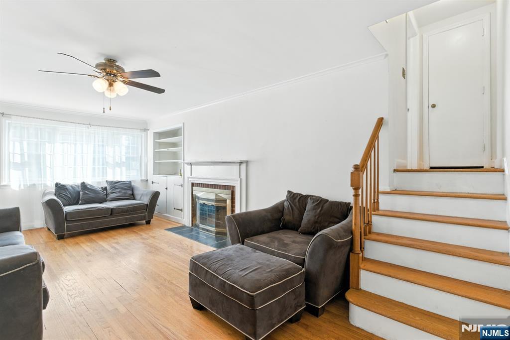 42 Meadow Lane Bloomfield, NJ 07003 - Photo 7 of 37 a living room with furniture and a fireplace