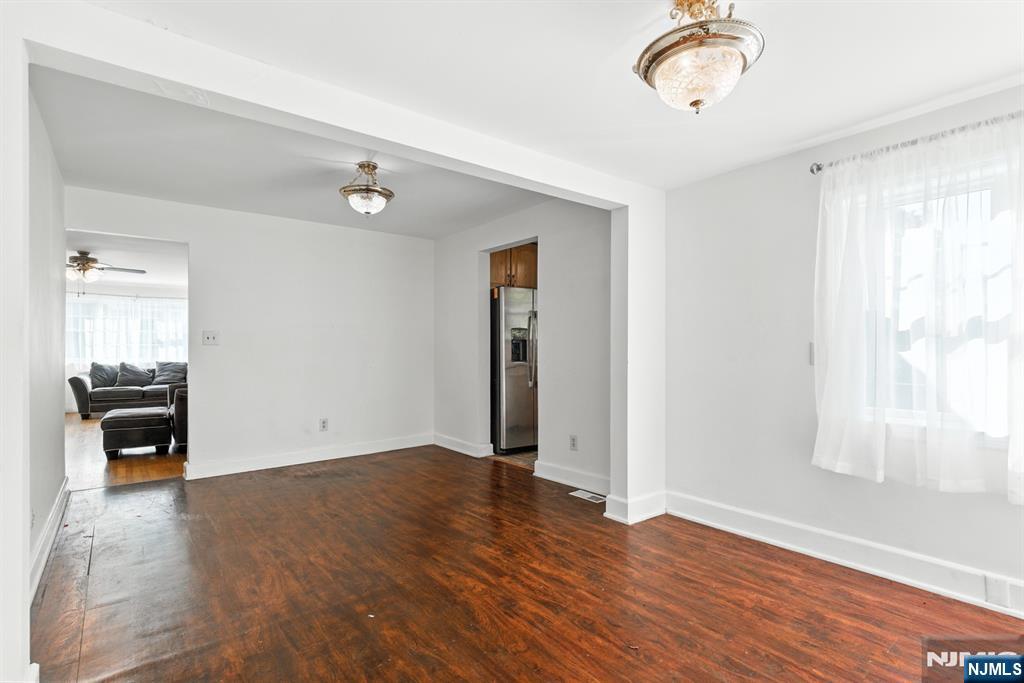 42 Meadow Lane Bloomfield, NJ 07003 - Photo 9 of 37 wooden floor in an empty room with a window