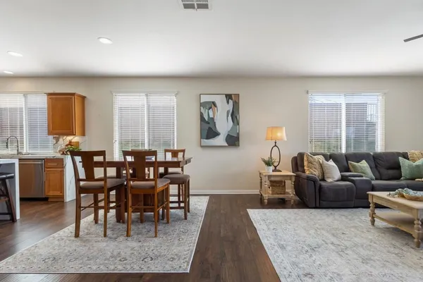 a bedroom with bed tv and window