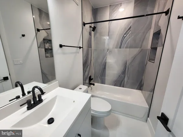 a bathroom with a sink and mirror