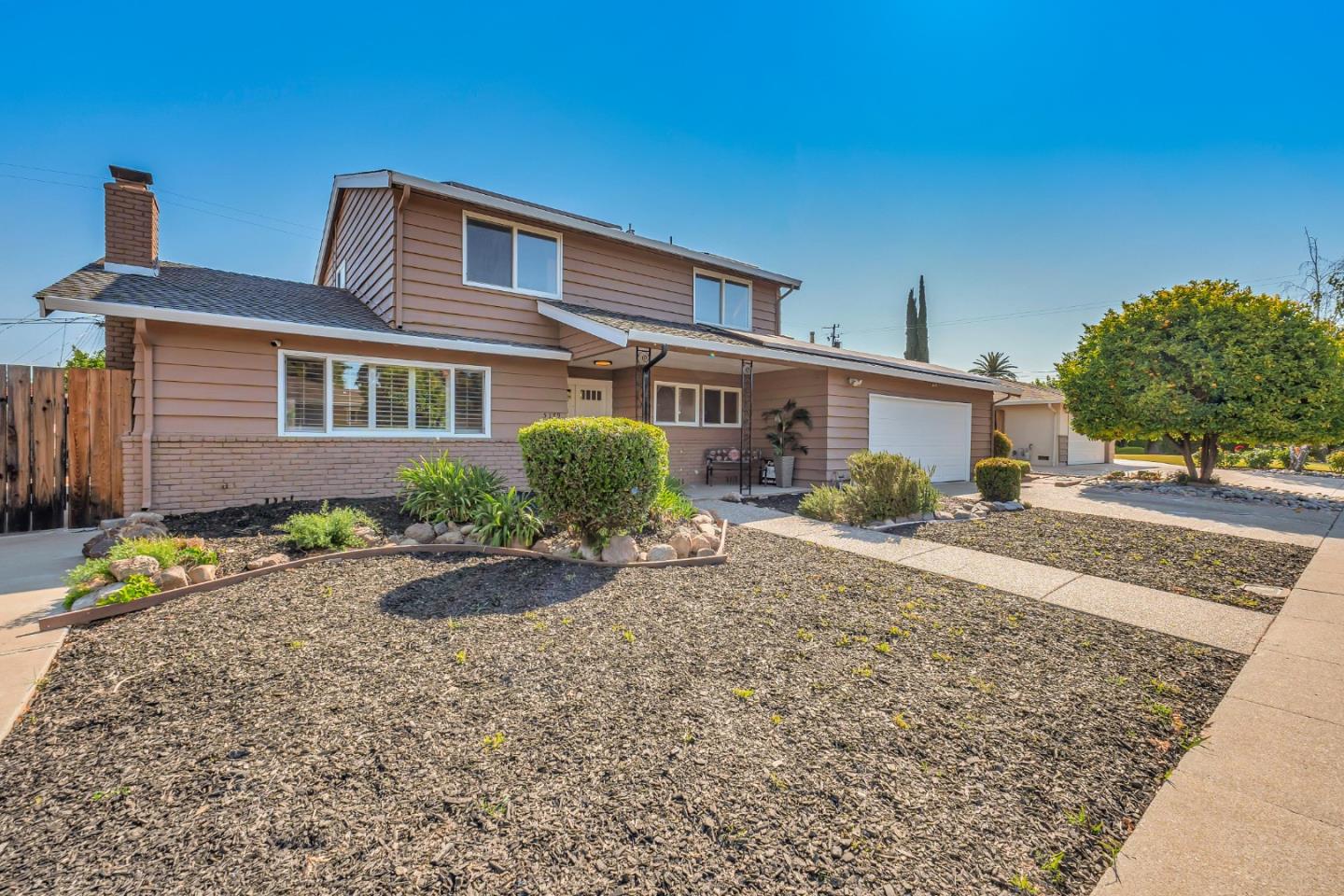 5179 Paul Scarlet Drive Concord, CA 94521 - Photo 1 of 1 a front view of a house with garden
