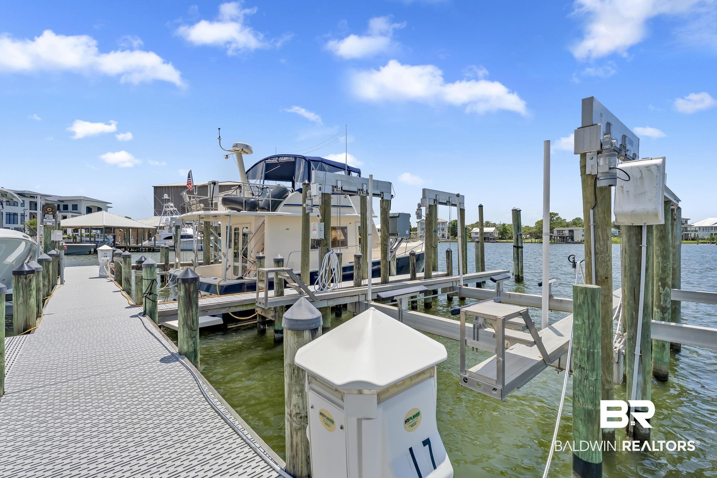 28250 Canal Road, Unit 307 Orange Beach, AL 36561 - Photo 16 of 56 Dock with a water view and boat lift