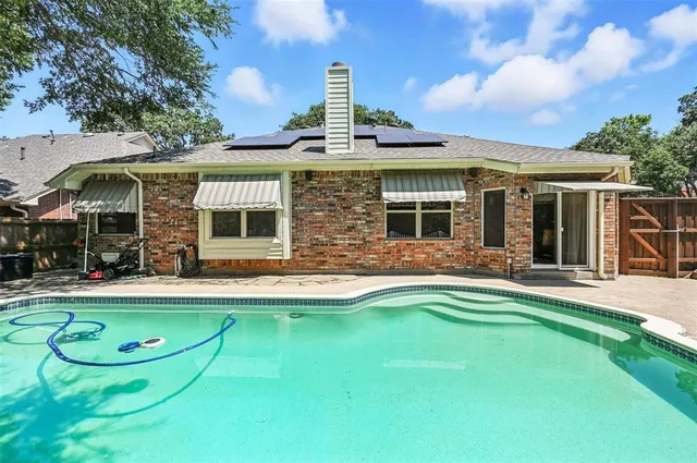 a front view of house with yard outdoor seating and garage