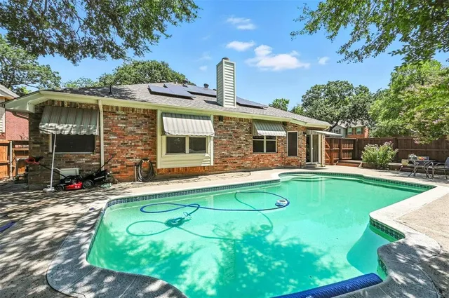 a view of a house with a swimming pool