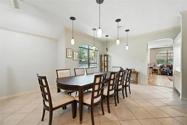 a view of a dining room and livingroom with furniture
