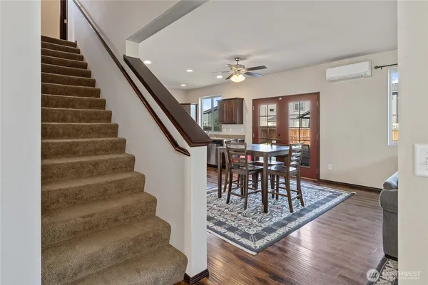 a view of a livingroom with furniture and wooden floor