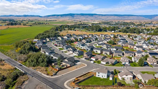 an aerial view of residential houses and outdoor space