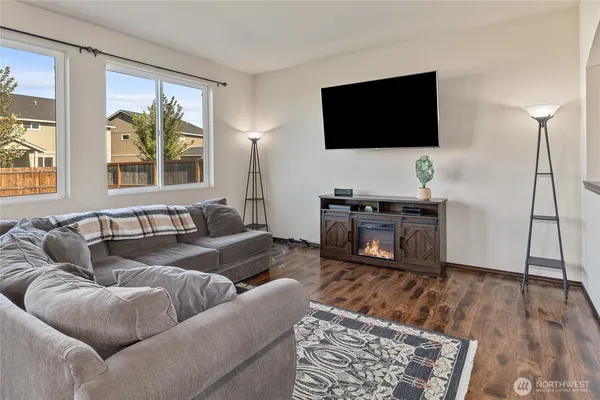 a living room with furniture and a flat screen tv