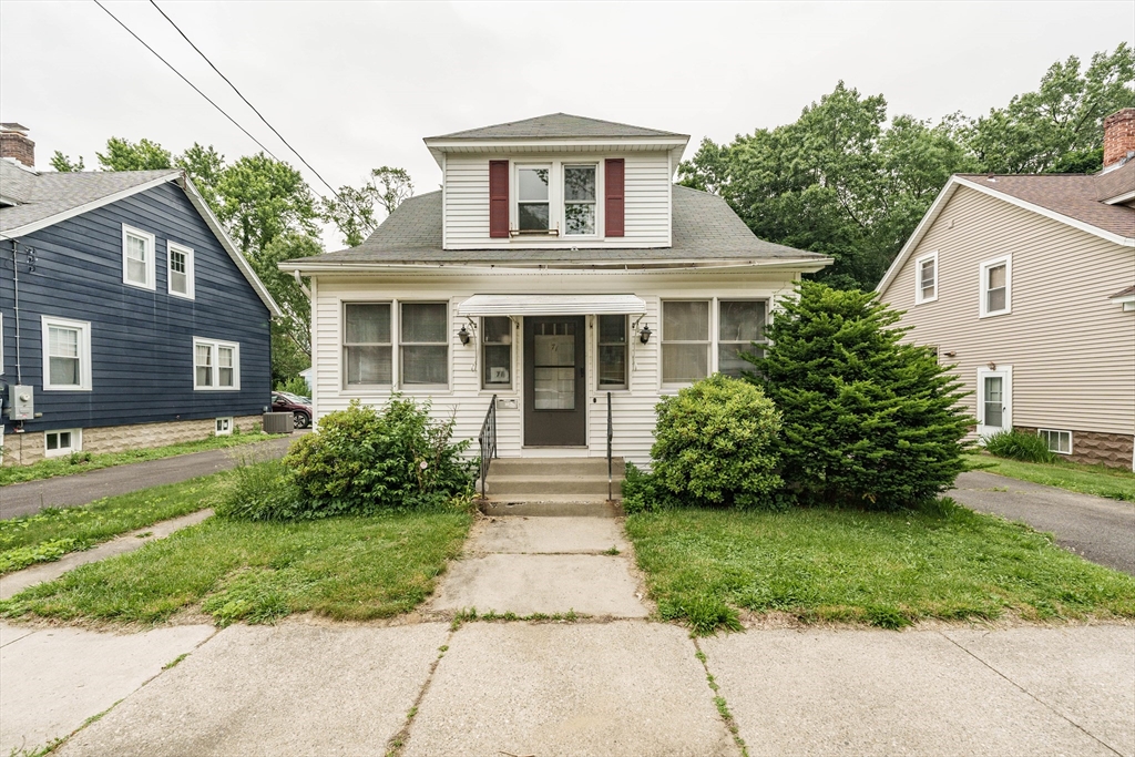 71 Daviston Street Springfield, MA 01108 - Photo 1 of 32 a front view of a house with garden