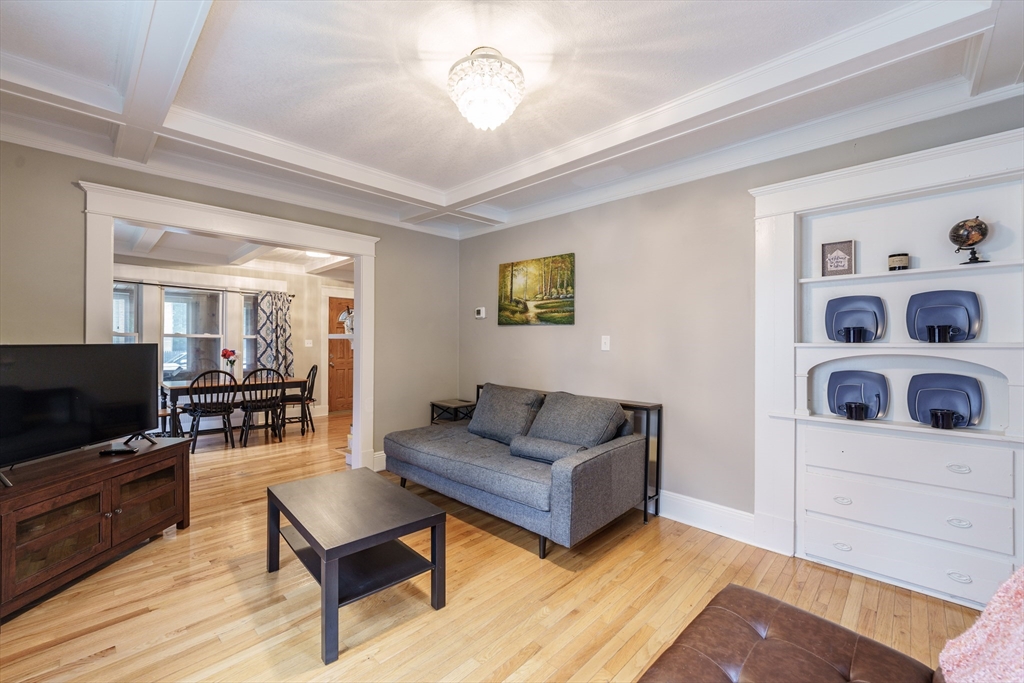 71 Daviston Street Springfield, MA 01108 - Photo 21 of 32 a living room with furniture and a flat screen tv
