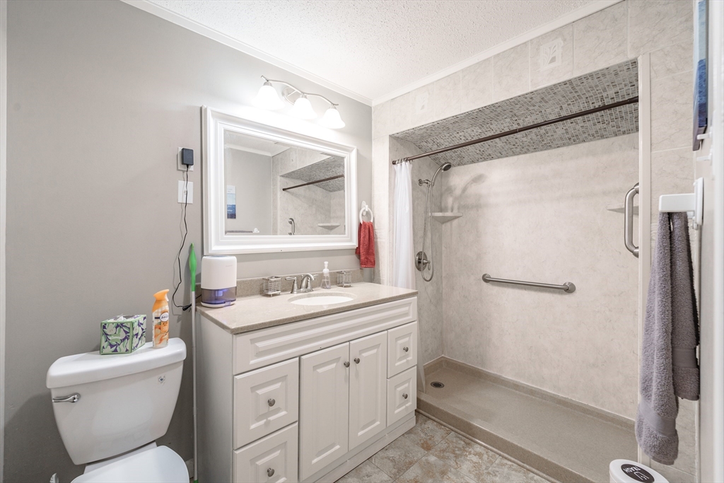 71 Daviston Street Springfield, MA 01108 - Photo 22 of 32 a bathroom with a granite countertop sink toilet and shower