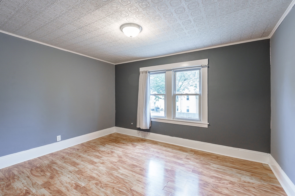 71 Daviston Street Springfield, MA 01108 - Photo 24 of 32 a view of an empty room with a window