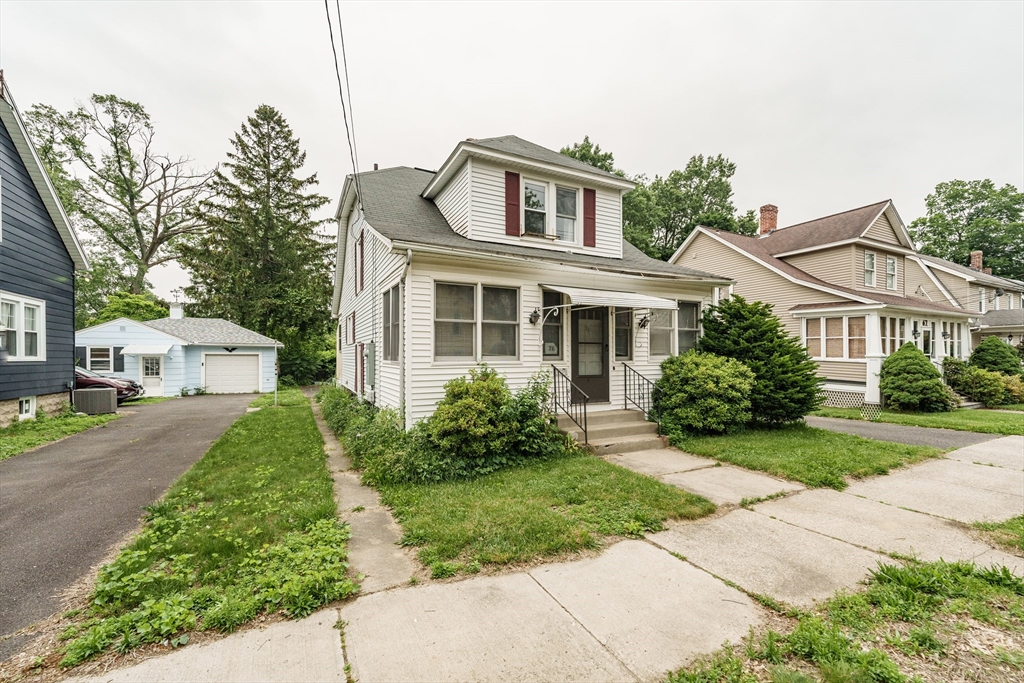 71 Daviston Street Springfield, MA 01108 - Photo 3 of 32 a front view of a house with a yard