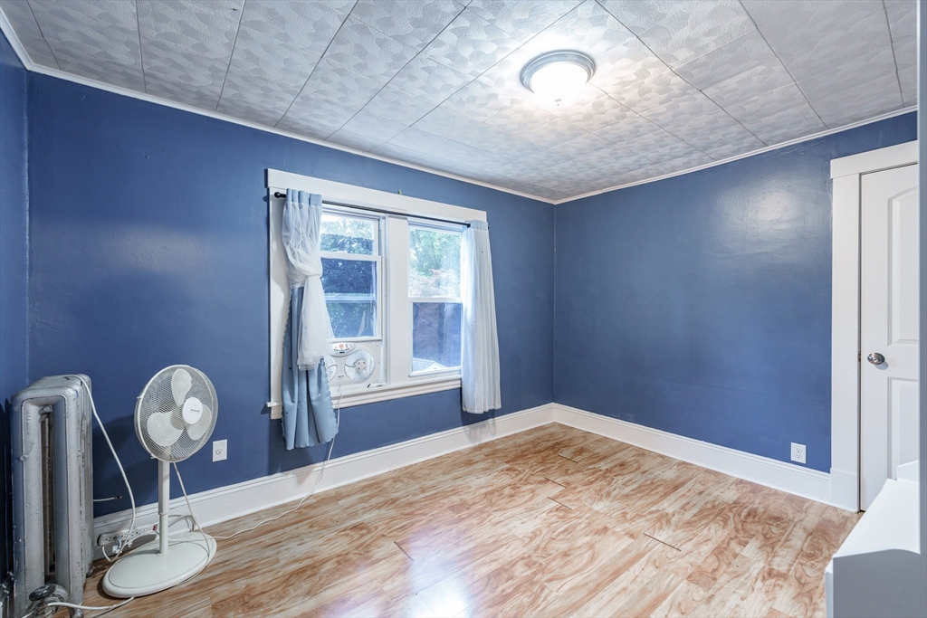 71 Daviston Street Springfield, MA 01108 - Photo 32 of 32 a view of empty room with wooden floor