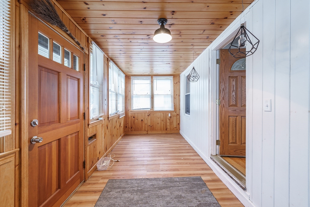 71 Daviston Street Springfield, MA 01108 - Photo 9 of 32 a view of a hallway with a chandelier
