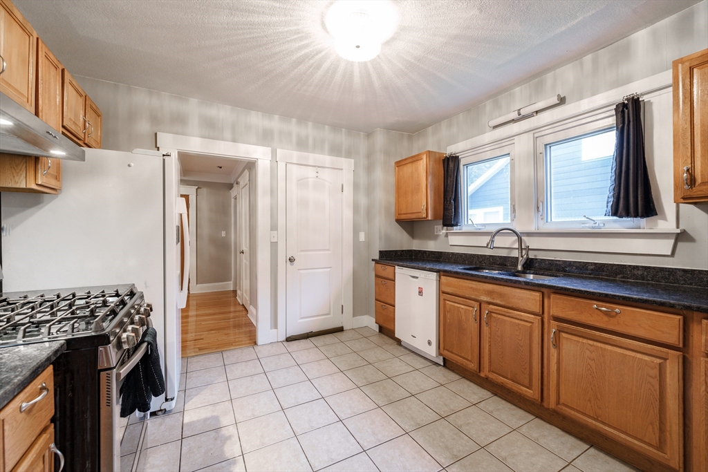 71 Daviston Street Springfield, MA 01108 - Photo 10 of 32 a spacious bathroom with a sink a mirror and a shower