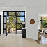 a view of a living room and floor to ceiling window or kitchen