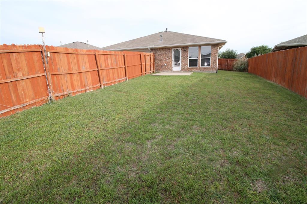 4188 Cherry Ridge Drive Frisco, TX 75033 - Photo 23 of 25 a front view of a house with a yard