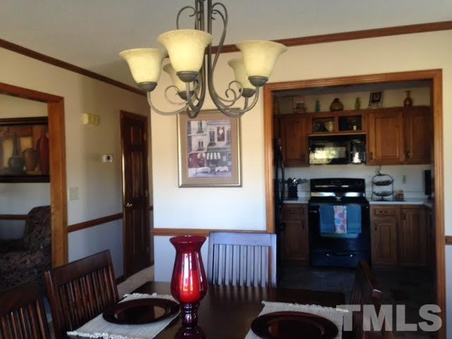 1386 Warren Road Dunn, NC 28334 - Photo 13 of 23 view of dining and kitchen and hall