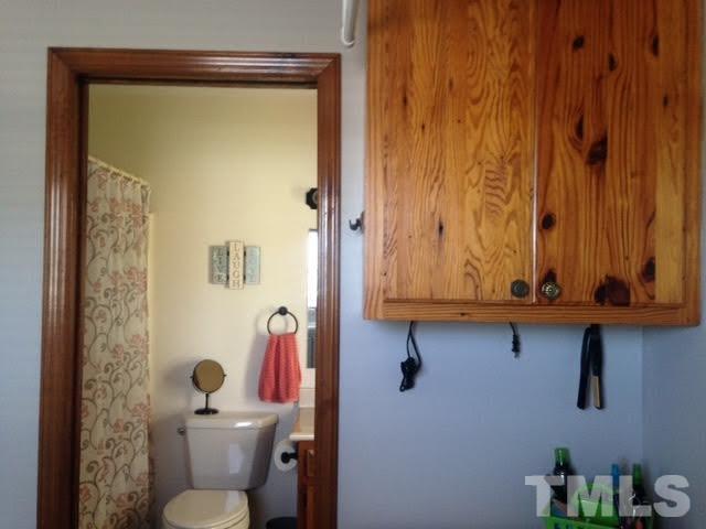 1386 Warren Road Dunn, NC 28334 - Photo 19 of 23 A nice feature with Master Bath next to laundry. Cabinet to convey.