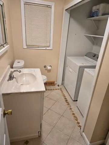 a bathroom with a sink toilet and tub