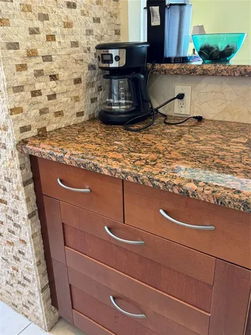 a stove top oven sitting inside of a kitchen