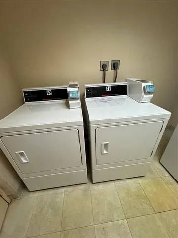 a front view of a building with a garden