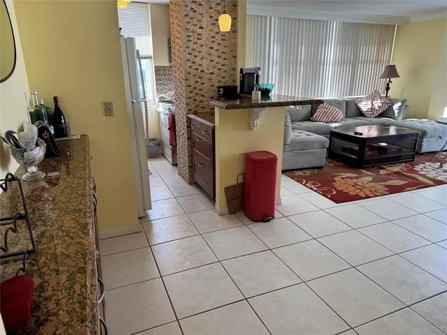 a kitchen with a sink and a stove top oven