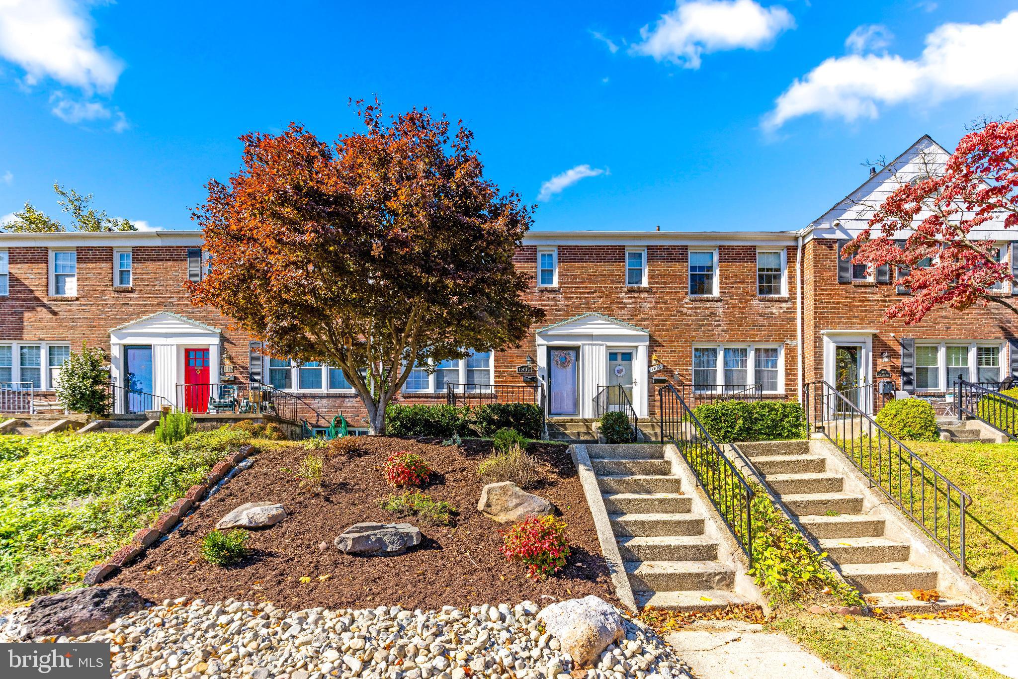 1815 Loch Shiel Road Towson, MD 21286 - Photo 1 of 32 a front view of a house with a yard