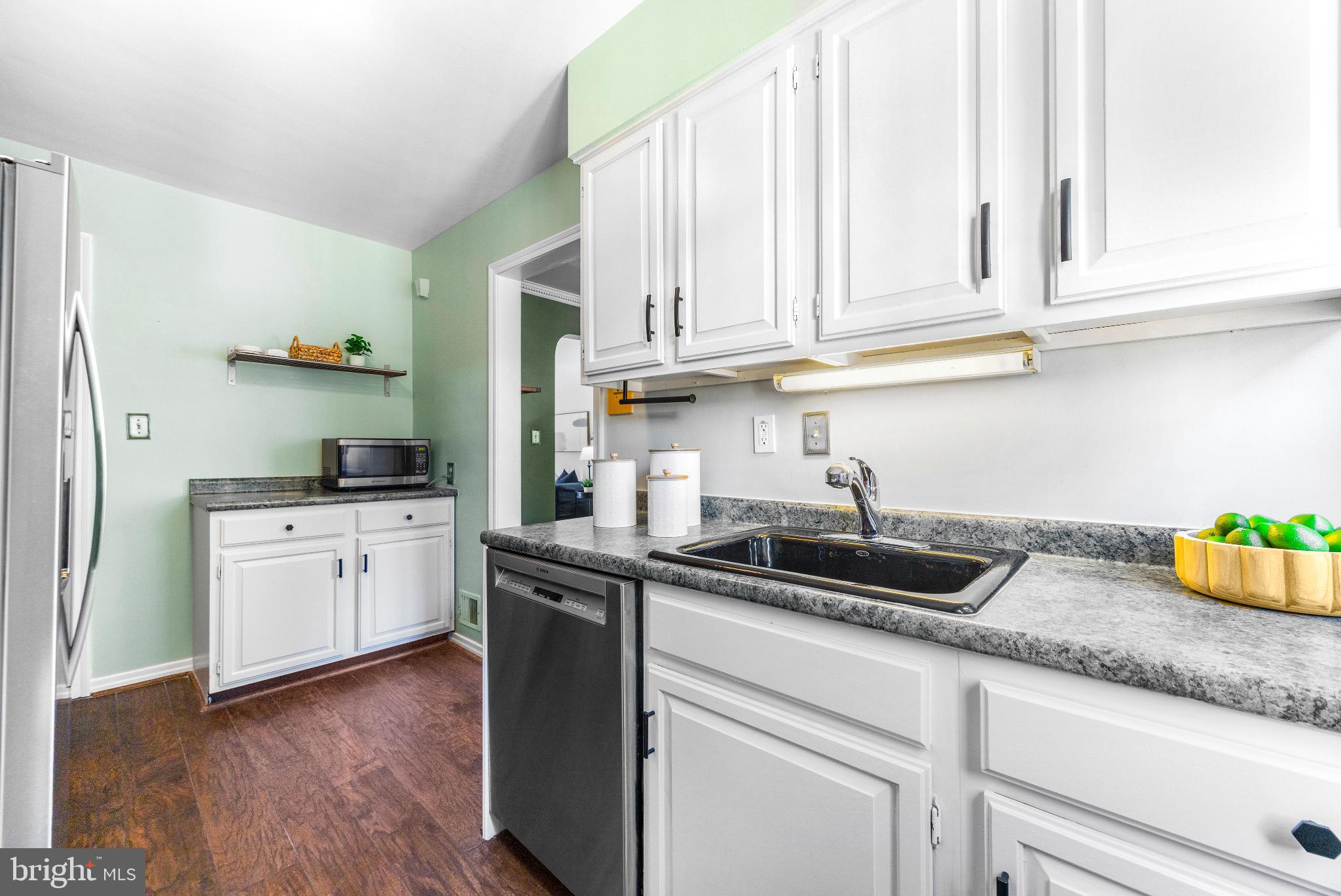 1815 Loch Shiel Road Towson, MD 21286 - Photo 10 of 32 a kitchen with granite countertop white cabinets and a sink