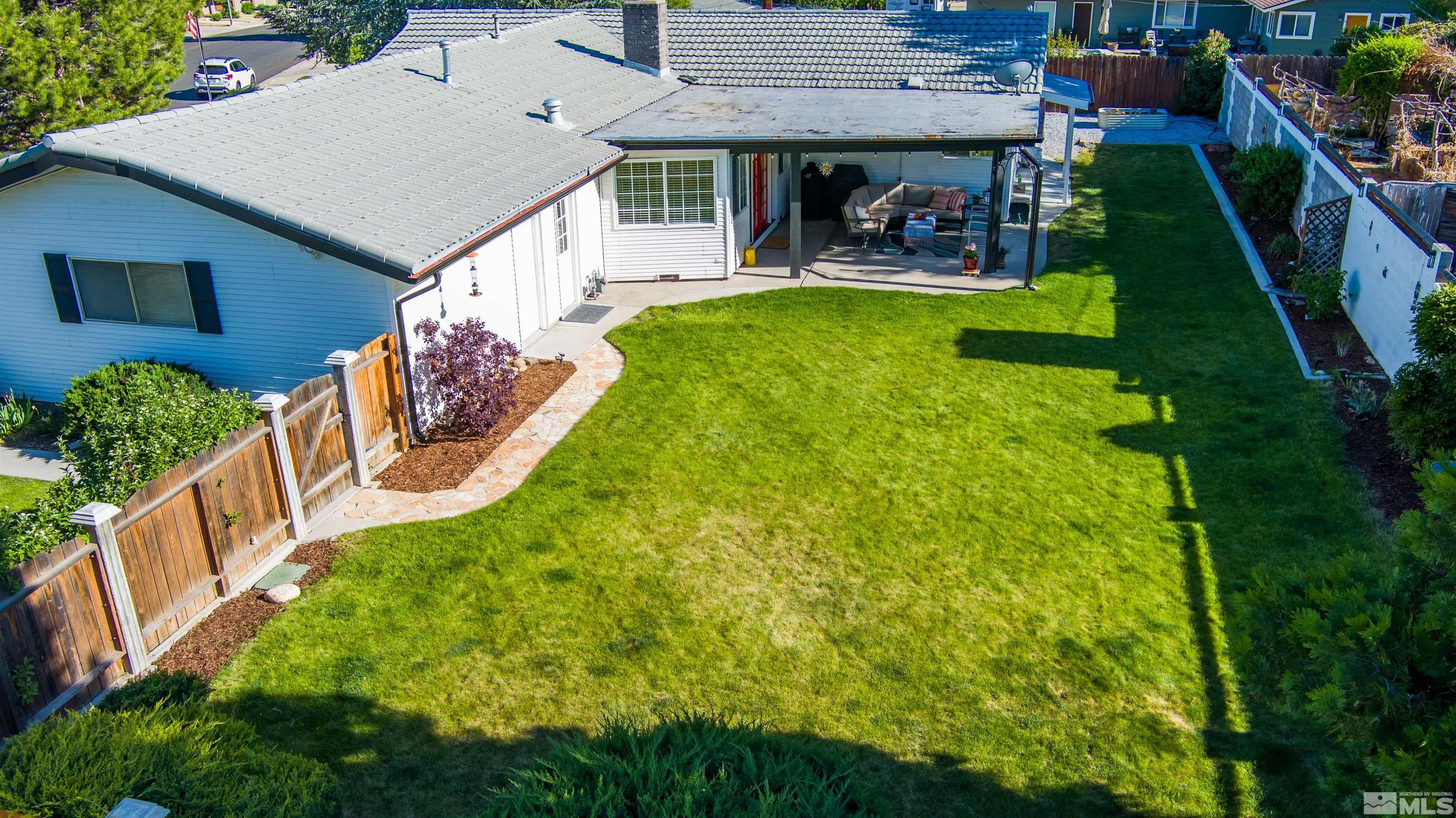 3901 Warren Way Reno, NV 89509 - Photo 36 of 40 a view of a house with pool and chairs