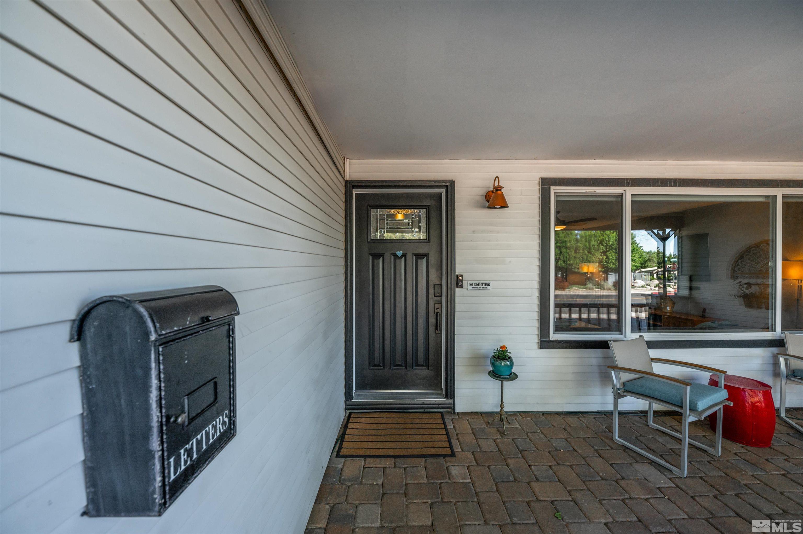 3901 Warren Way Reno, NV 89509 - Photo 9 of 40 a front view of a house with outdoor seating