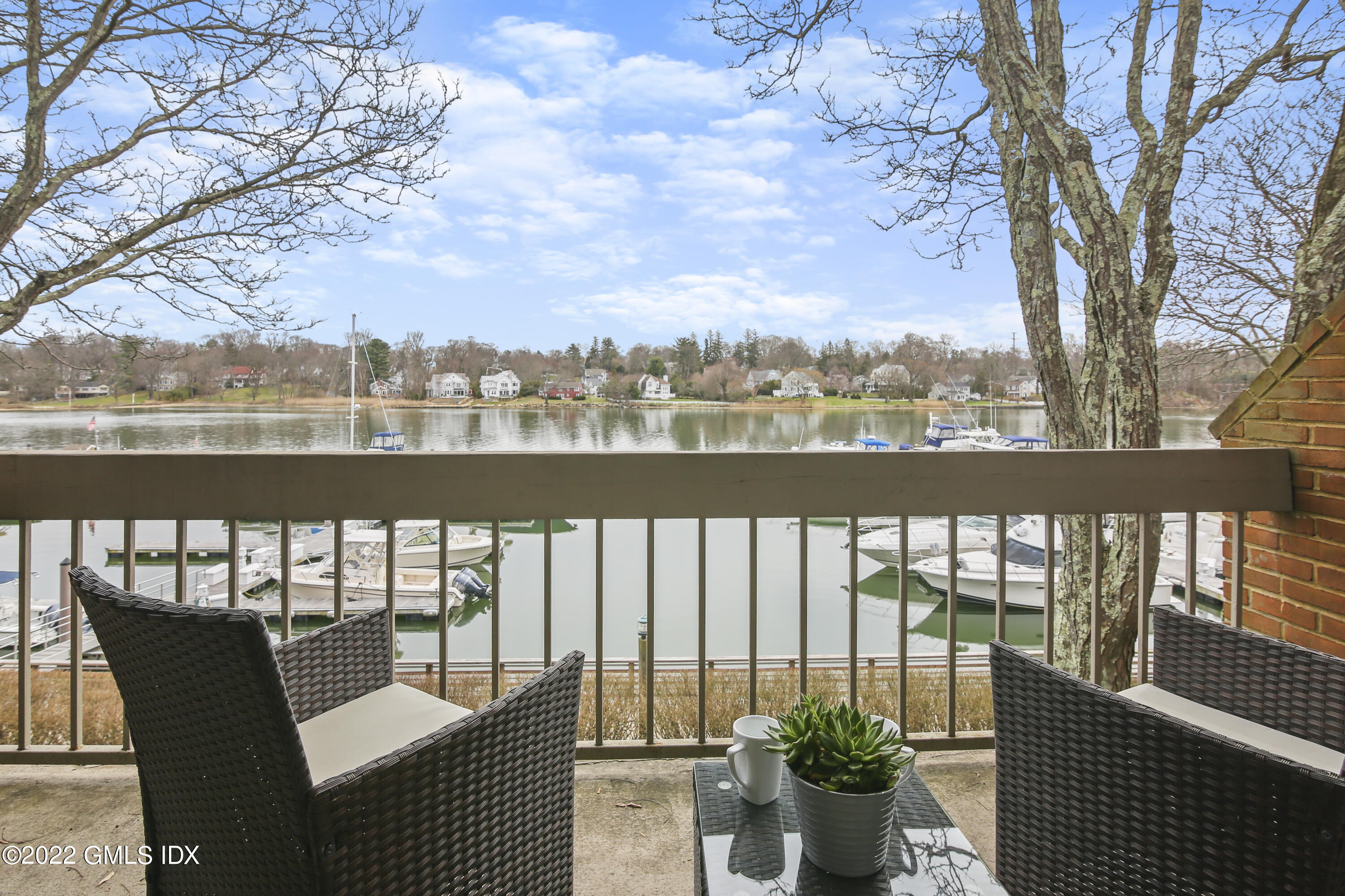 a view of a chairs and table in the balcony