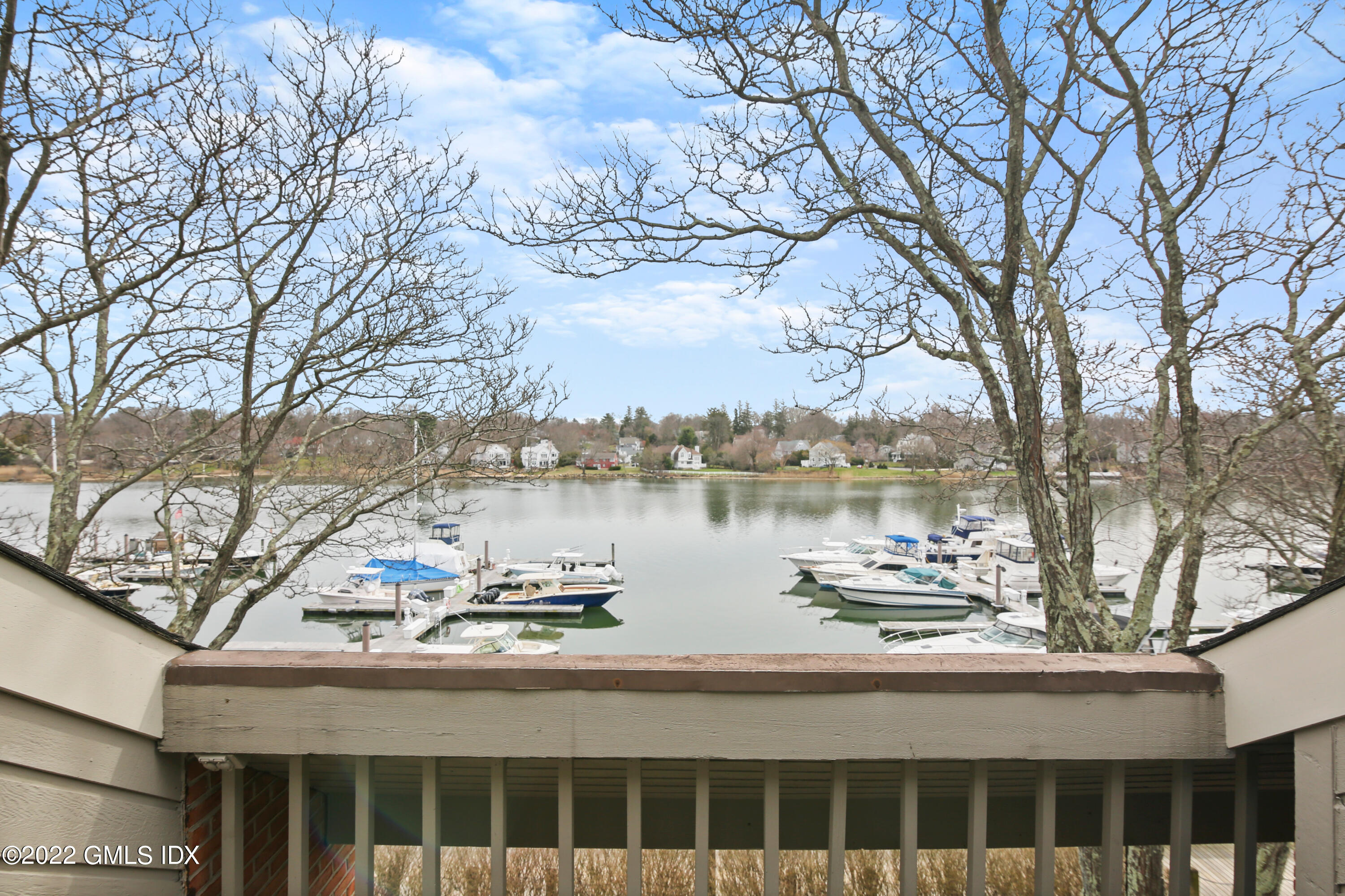 15 River Road, Unit 213 Cos Cob, CT 06807 - Photo 11 of 20 a view of a chairs and table on the terrace