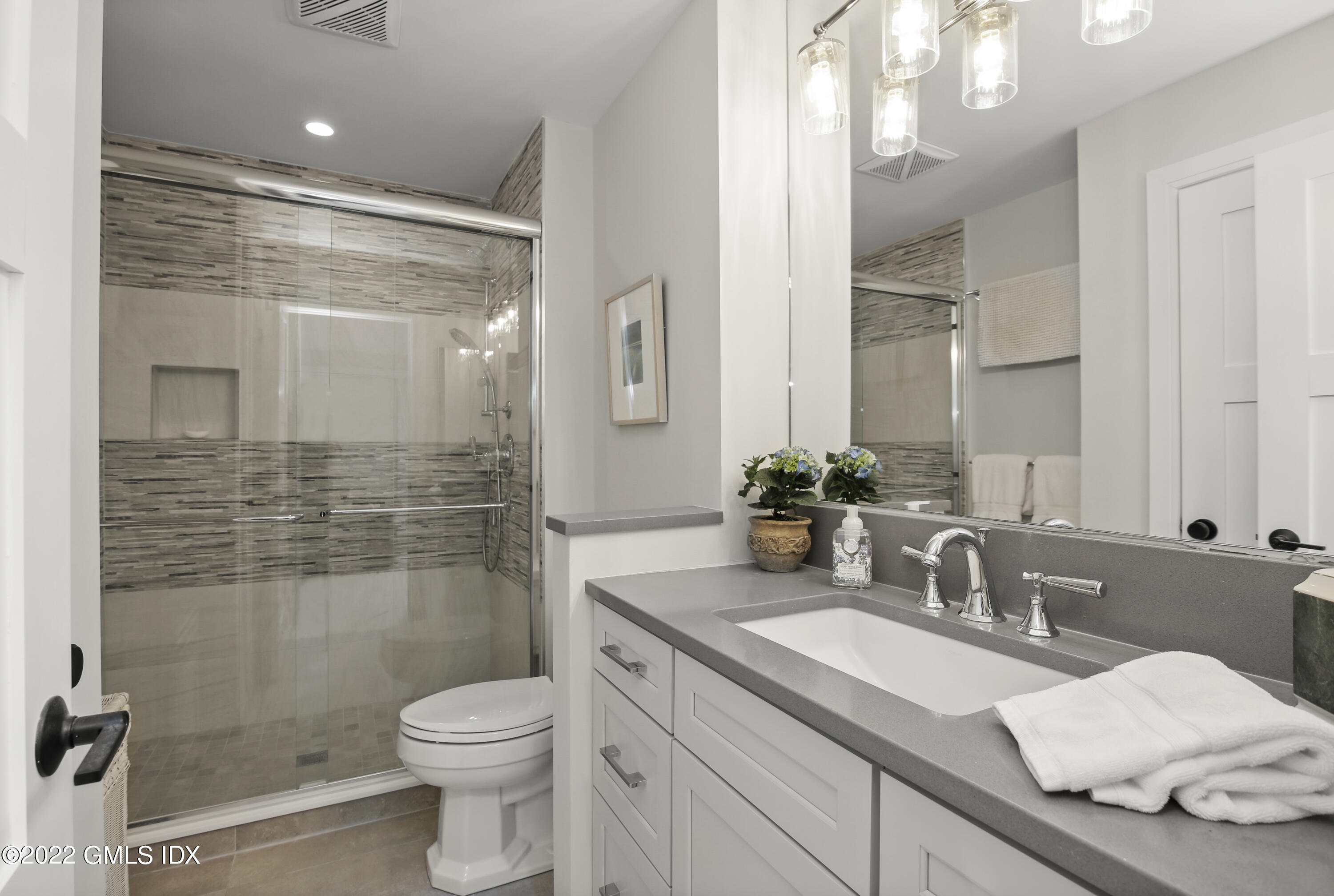 15 River Road, Unit 213 Cos Cob, CT 06807 - Photo 12 of 20 a bathroom with a sink a toilet and shower
