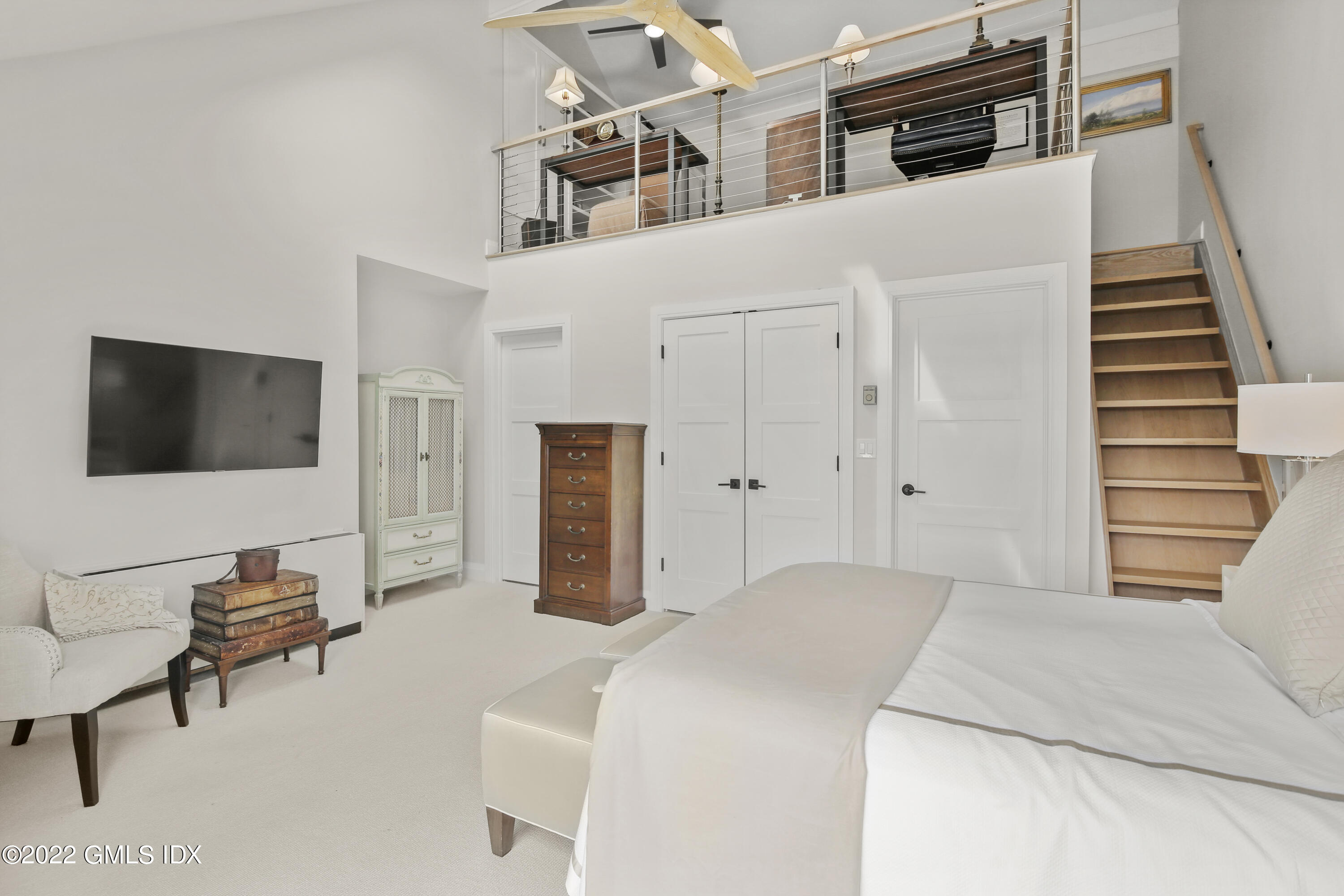 15 River Road, Unit 213 Cos Cob, CT 06807 - Photo 13 of 20 a bedroom with furniture and a flat screen tv