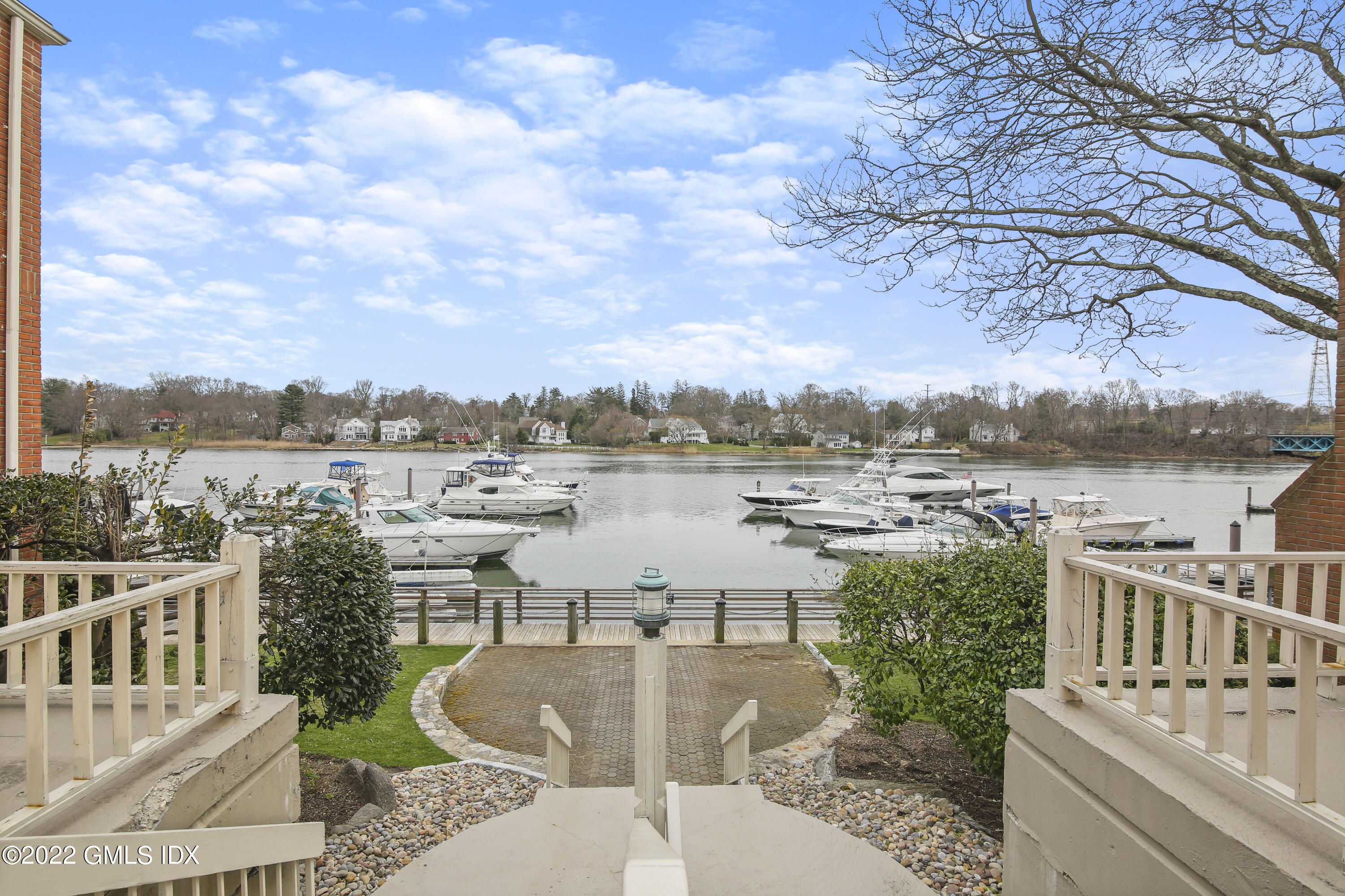 15 River Road, Unit 213 Cos Cob, CT 06807 - Photo 18 of 20 a view of a lake with couches and city view