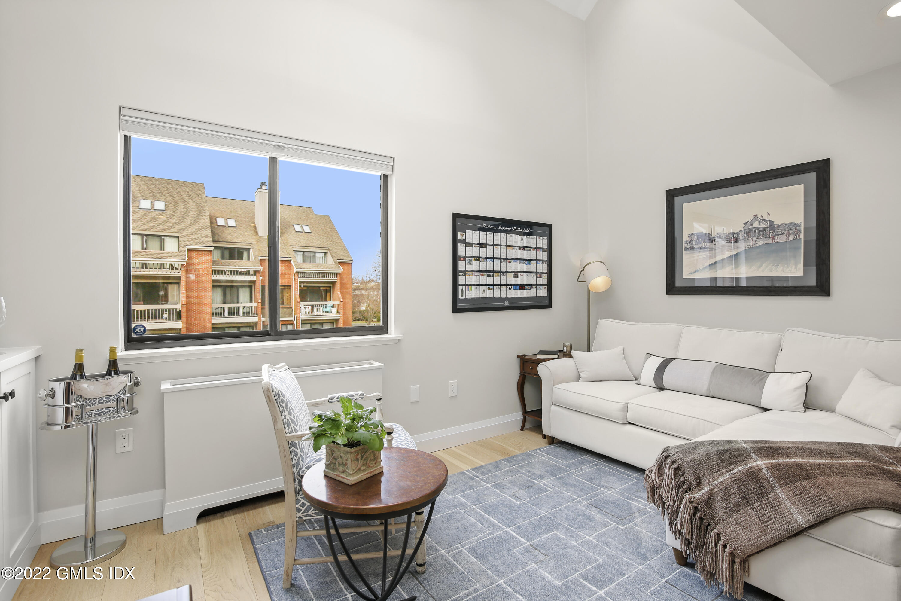 15 River Road, Unit 213 Cos Cob, CT 06807 - Photo 6 of 20 a living room with furniture and window