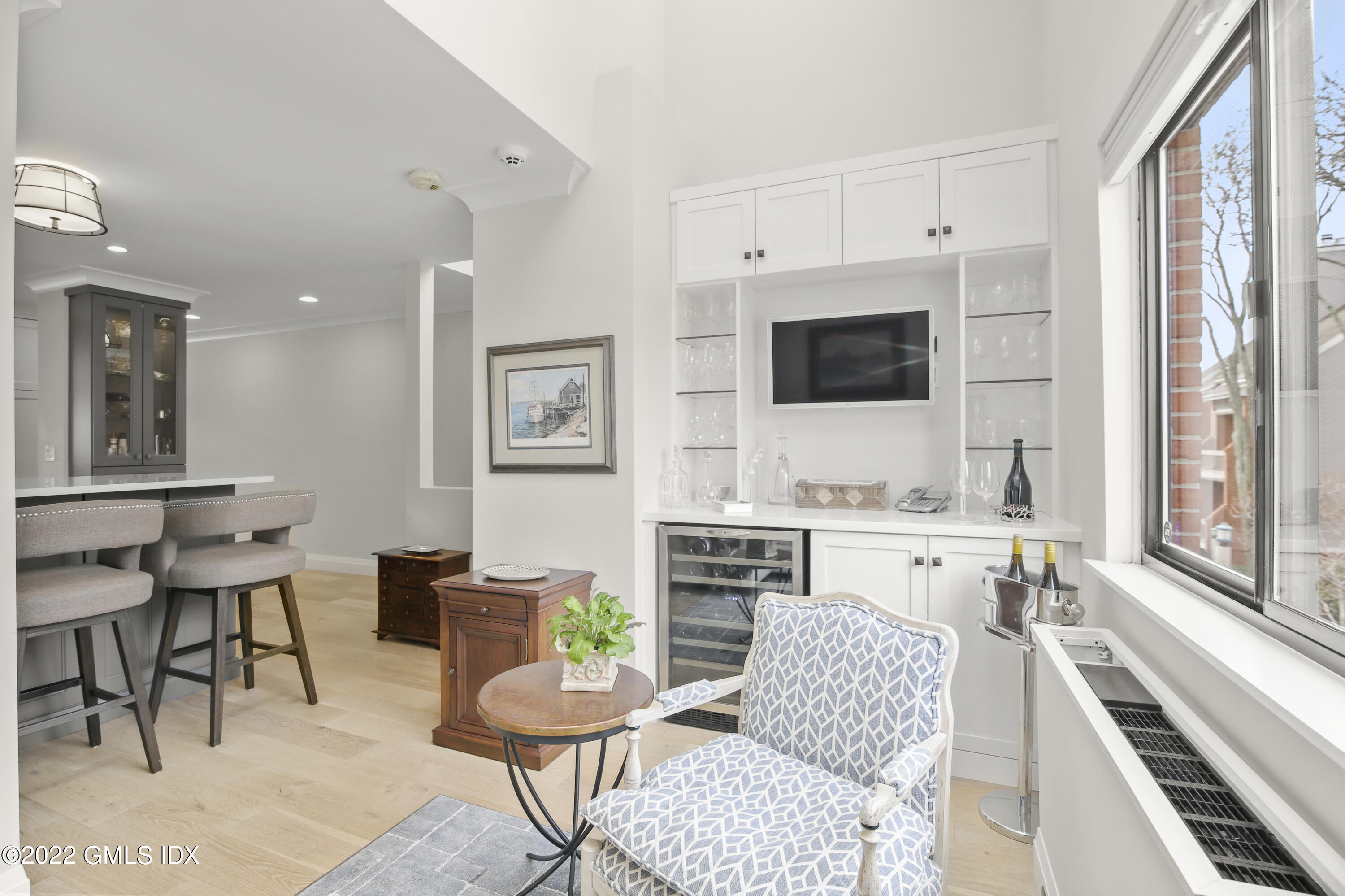 15 River Road, Unit 213 Cos Cob, CT 06807 - Photo 7 of 20 a living room with furniture and a flat screen tv