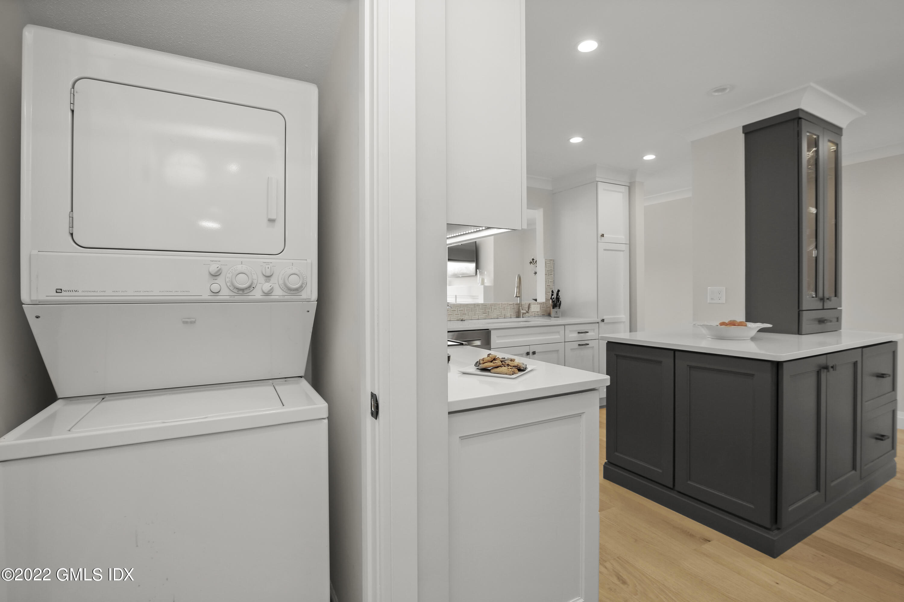 15 River Road, Unit 213 Cos Cob, CT 06807 - Photo 8 of 20 a kitchen with a sink a stove and cabinets