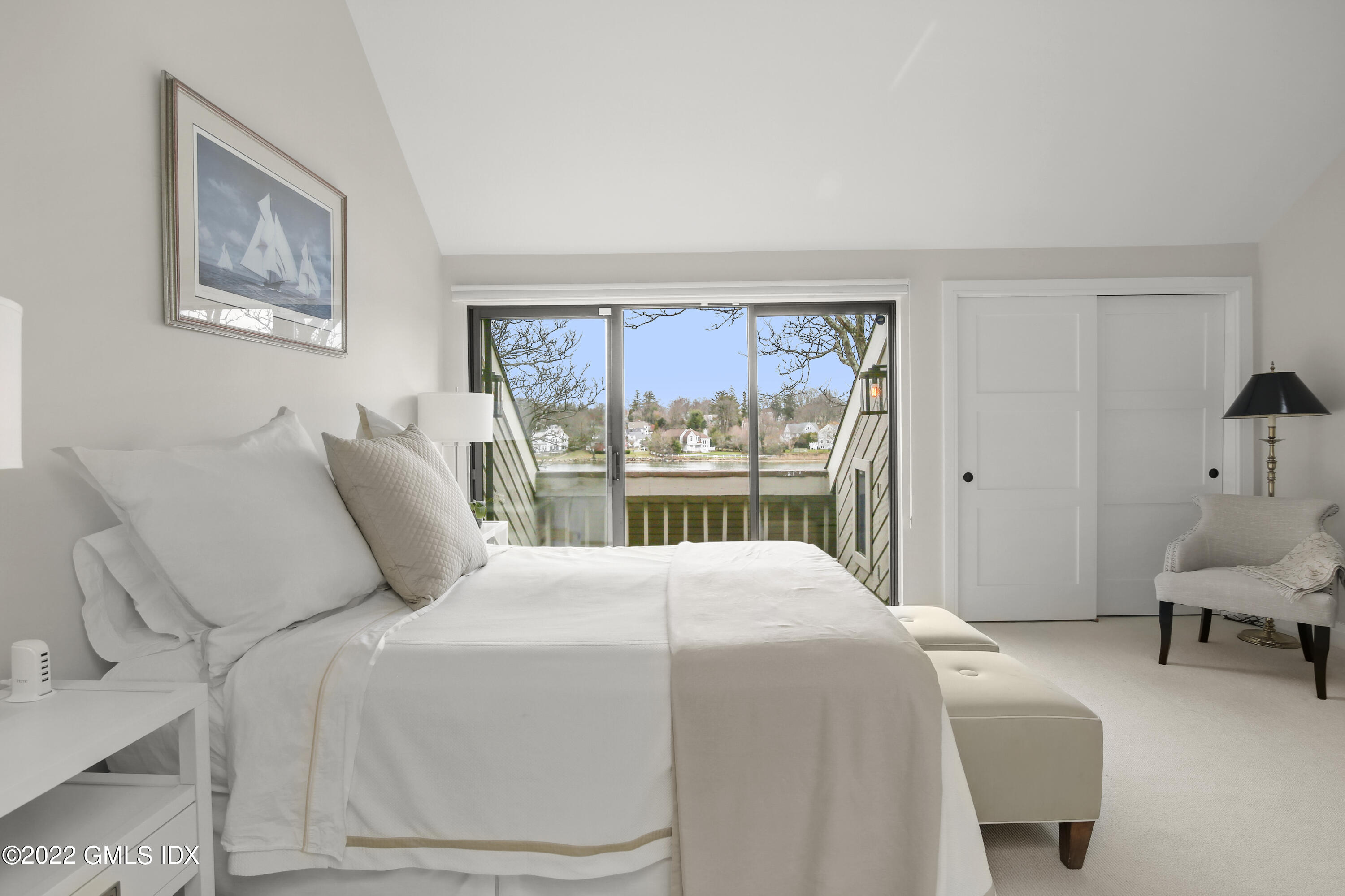 15 River Road, Unit 213 Cos Cob, CT 06807 - Photo 10 of 20 a bedroom with a large bed and a window