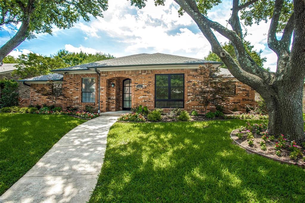 6926 Northwood Road Dallas, TX 75225 - Photo 1 of 29 a front view of a house with garden
