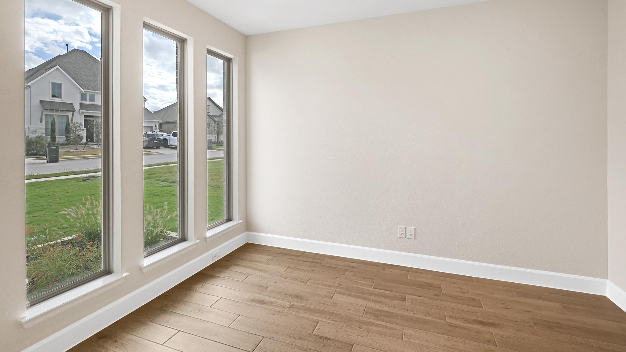 338 Prickly Poppy Loop Kyle, TX 78640 - Photo 11 of 40 Unfurnished room with baseboards and wood finished floors