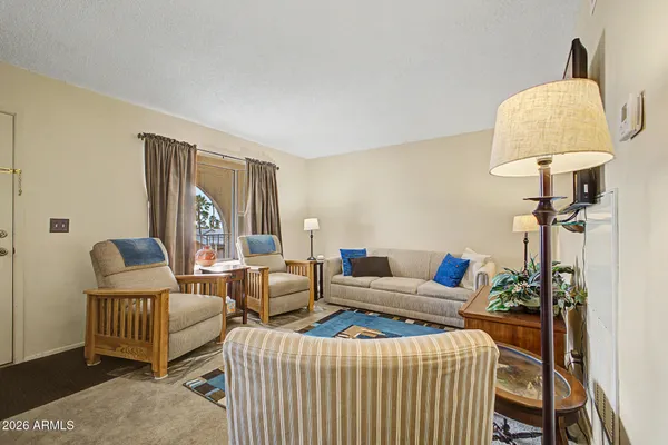 a living room with furniture and a large window