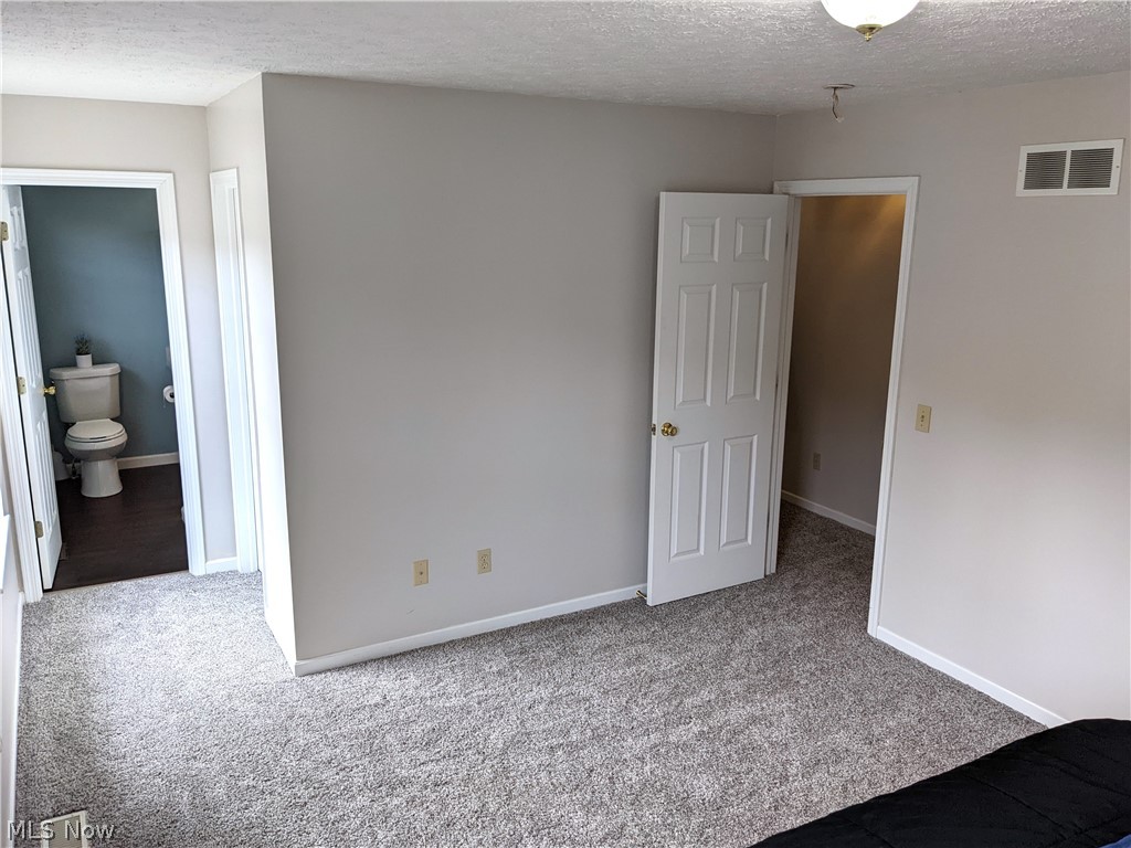 4175 Beckley Road Stow, OH 44224 - Photo 21 of 33 From the master the entrance to the bath and the walk-in closet on the left.