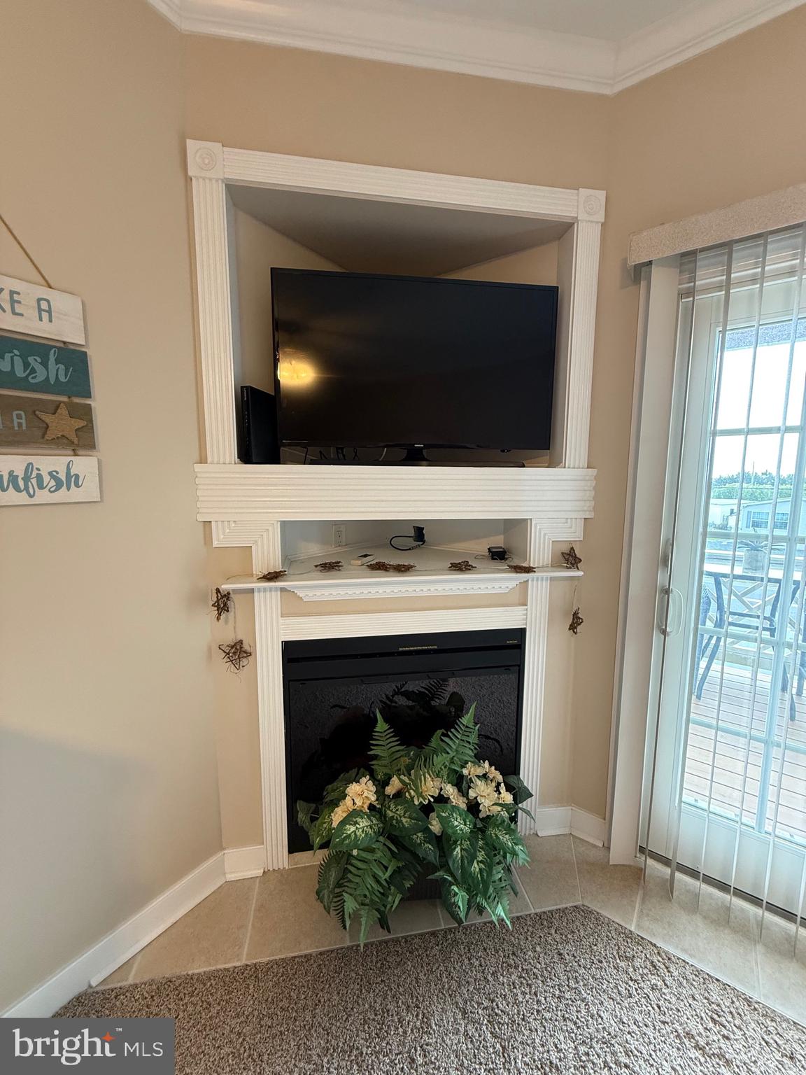 9823 Golf Course Road, Unit 20 Ocean City, MD 21842 - Photo 18 of 61 Corner Fireplace and TV setup