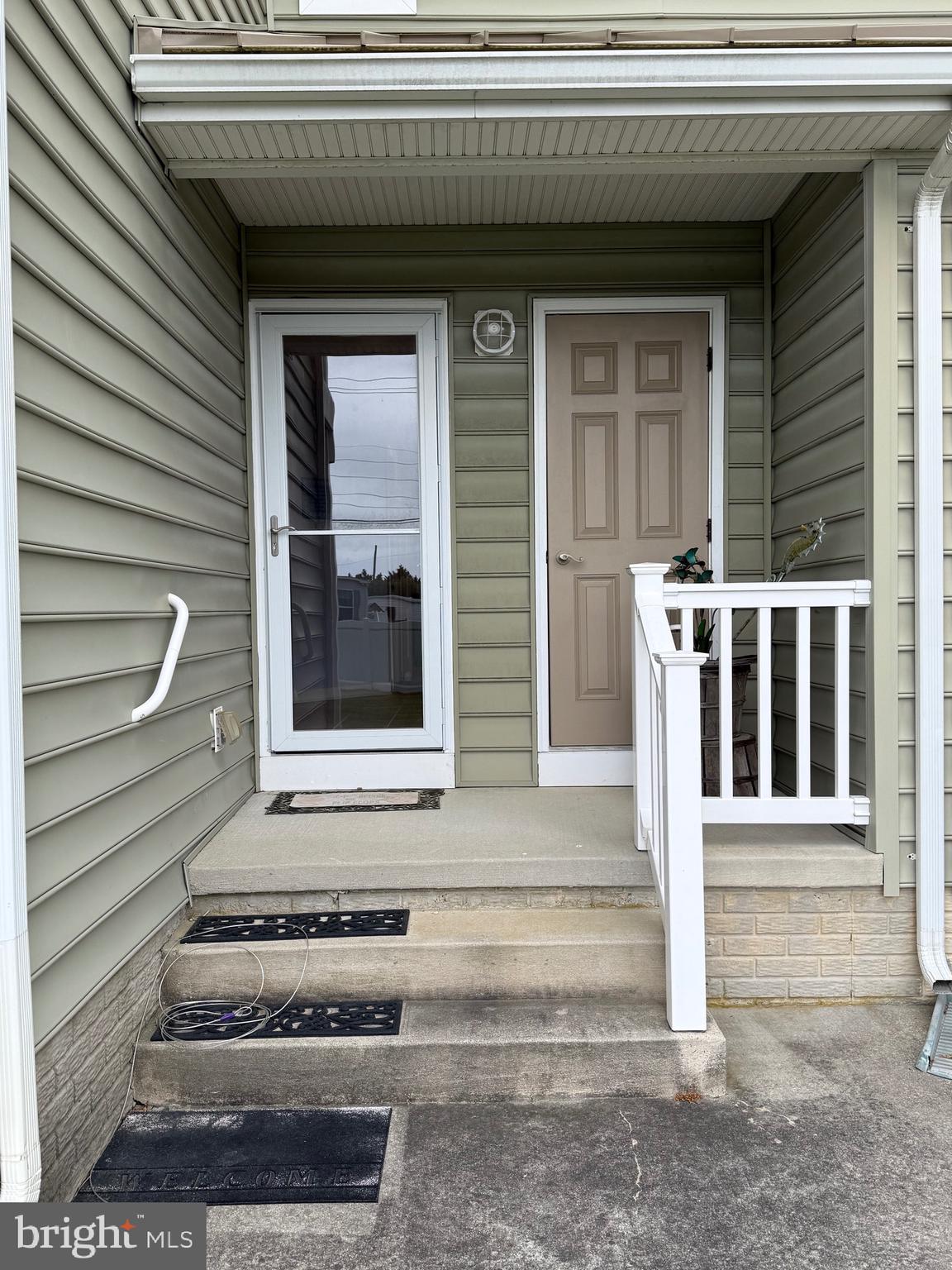 9823 Golf Course Road, Unit 20 Ocean City, MD 21842 - Photo 19 of 61 Back door entry and porch